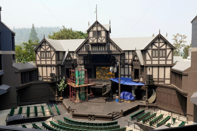 This Aug. 10, 2018 photo provided by the Oregon Shakespeare Festival shows the outdoor theatre with wildfire smoke on the horizon in Ashland, Ore. The famed Shakespeare festival, that attracts tourists from around the world, says it lost $2 million this summer because smoke from wildfires forced it to cancel more than two dozen outdoor performances. (Kim Budd/Oregon Shakespeare Festival via AP)