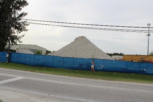 A mound of by-products from the cement-processing facility north of Myrtle Avenue and across from Booker High School in Sarasota's Newtown neighborhood. [Photo courtesy Lisa Merritt]