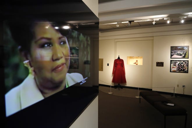 An exhibit at the Charles H. Wright Museum of African American History features a "tribute to the Queen of Soul." "THINK" opens to the public Tuesday at the museum that hosted Aretha Franklin's public visitations after her death last month. It features archival photographs, videos and the red shoes she wore at her first visitation that drew global attention. [AP Photo/Carlos Osorio]