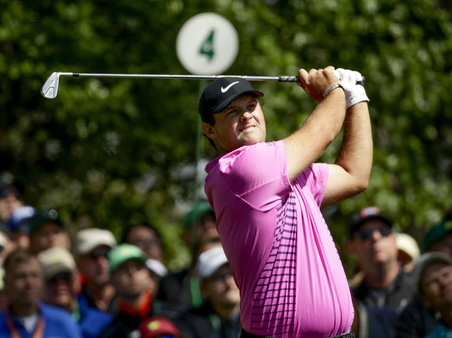 Patrick Reed hits on the fourth tee during the final round on his way to winning The Masters on April 8 in Augusta, Ga. [AP Photo/Chris Carlson]