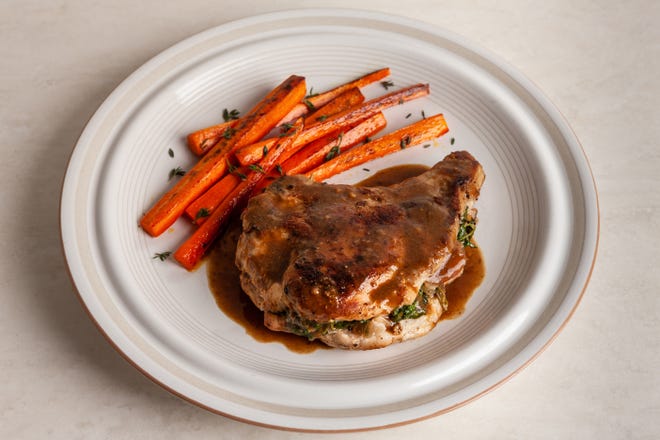 Some decidedly fall-type flavors help lift this recipe for Apple and Kale Stuffed Pork Chops With Riesling Mustard Sauce. 



(The Washington Post/Goran Kosanovic)