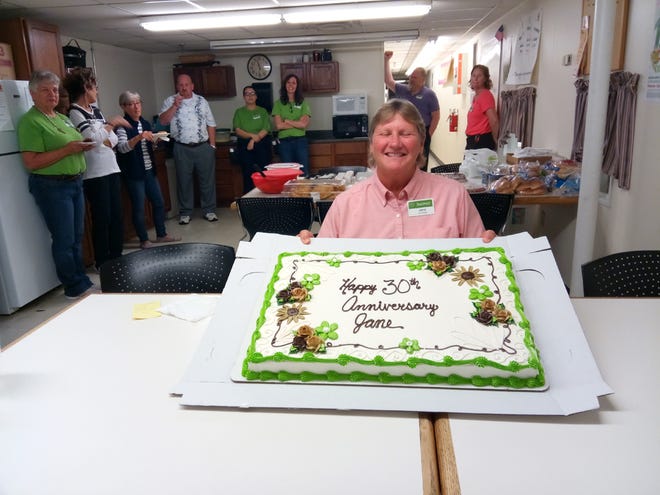 Monmouth Shopko Manager Jane Gillam celebrates 30 years with the store with a cake.