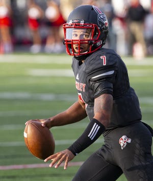 McKinley's Alijah Cutis looks to completed a pass for a two-point conversion against Warren Harding on Friday, August 24, 2018. (CantonRep.com / File)