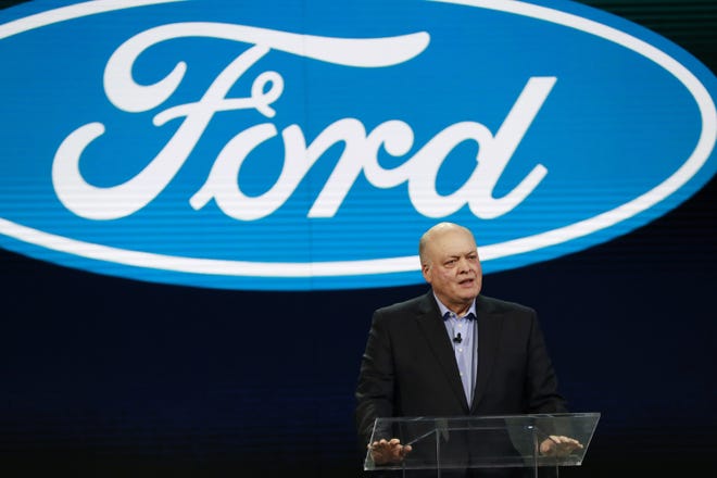 In this Jan. 14 file photo, Ford President and CEO Jim Hackett prepares to address the media at the North American International Auto Show in Detroit. [AP Photo/Carlos Osorio, File]