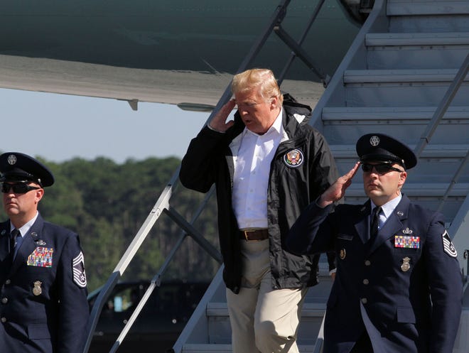 President Donald Trump salutes as he steps from Air Force One at MCAS Cherry Point in Havelock, N.C., last week. [Gray Whitley/ Sun Journal Staff]