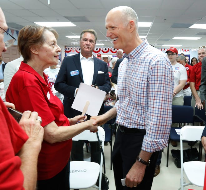 In 1 of her last public events, state Sen. Dorothy Hukill talks on July 20 with Gov. Rick Scott during the opening of the Republican Party of Volusia County headquarters in South Daytona. On Friday, Hukill announced she's withdrawing from her re-election bid after a recurrence of her cancer. [News-Journal/Nigel Cook]
