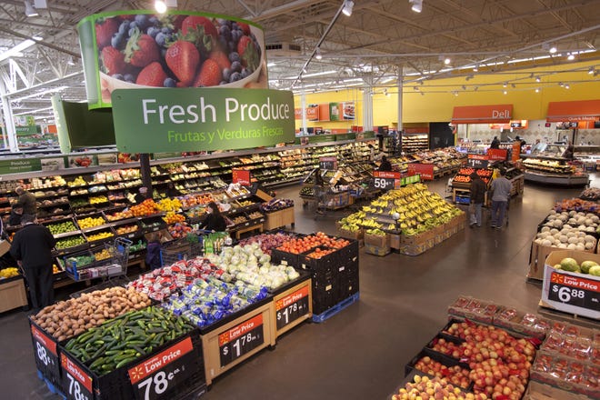 Shoppers browse fresh produce in the Walmart in North Bergen, N.J. The giant retailer will begin requiring lettuce and spinach suppliers to contribute to a blockchain database that can rapidly pinpoint contamination.  [Nadav Neuhaus / The New York Times]