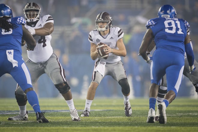 Mississippi State quarterback Nick Fitzgerald and his teammates will face their former head coach today. [Bryan Woolston/The Associated Press/File]