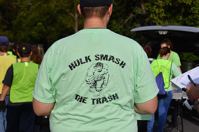 HULK SMASH — A large group of students from Randolph Early College High School converged on the Worthville area of Randleman Saturday to partcipate in the Randolph Big Sweep. They were sporting green shirts with the Hulk on back. (Paul Church / The Courier-Tribune)