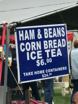 PHIL LUCIANO/JOURNAL STAR Clinton, Ill., celebrates its 50th Apple 'n Pork Festival on Saturday. One of the most popular offerings is the ham and beans.