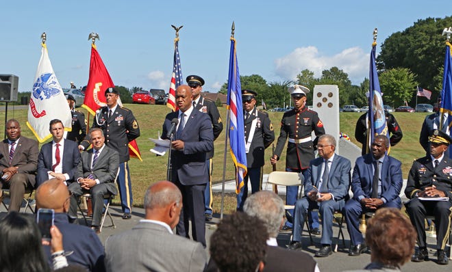 Luís Filipe Tavares, Cape Verde's minister of foreign affairs and defense, speaks at the Rhode Island Veterans Cemetery in Exeter during Saturday's dedication of a memorial honoring soldiers of Cape Verdean descent. [The Providence Journal / Steve Szydlowski]