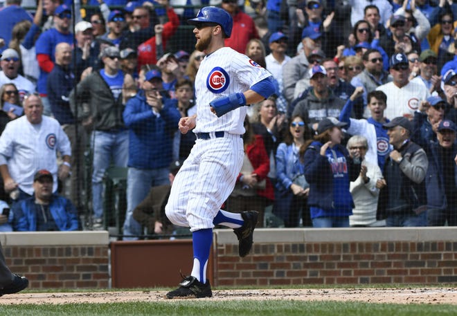 Chicago Cubs' Ben Zobrist scores during the first inning against the St. Louis Cardinals on Saturday, Sept. 29, 2018, in Chicago. [MATT MARTON/THE ASSOCIATED PRESS]