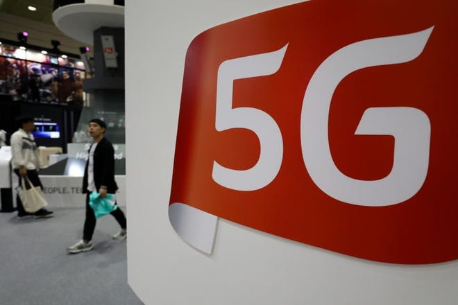 Displays promote 5G technology at the upcoming World IT Show 2018 in Seoul, South Korea. [BLOOMBERG PHOTO BY SEONGJOON CHO]