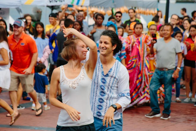 Savannah Mambo led a basic Salsa class to festival attendees. Many turned the John Rousakis plaza into a dance floor during the 13th Annual Fiesta Latina. [Adriana Iris Boatwright/For Savannah Morning News]
