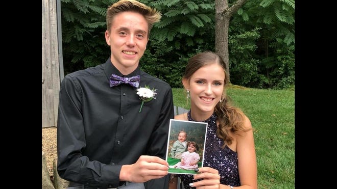 SUBMITTED PHOTO 

Brock Chumney and Sarah Stoneman, both New Philadelphia, attended New Philadelphia High School's Homecoming Sept. 22. Born only five days apart, both are enjoying their senior year. Their moms, Shawna Chumney and Terri Stoneman, had them pose with their baby picture from when they were 1-year-olds. Thanks to Shawna for sharing the photo.