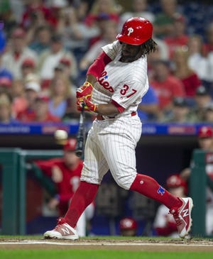 Phillies center fielder Odubel Herrera makes contact during Saturday's win over the Braves. [LAURENCE KESTERSON/THE ASSOCIATED PRESS]