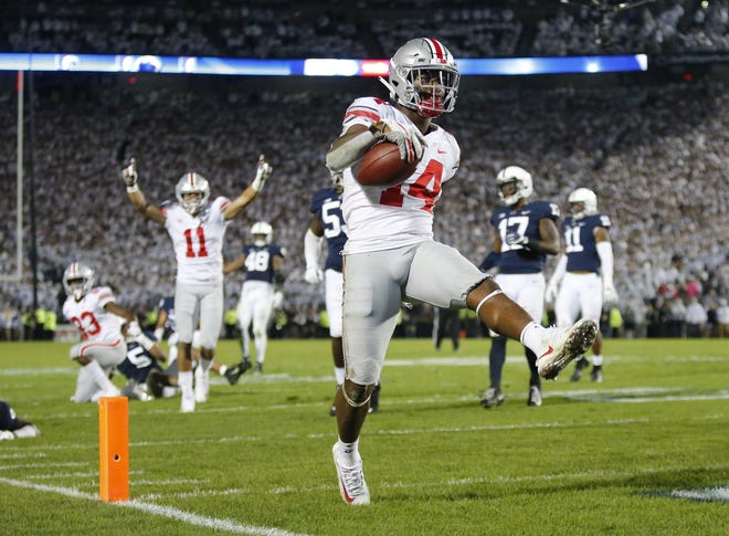 Ohio State receiver K.J. Hill Jr. high-steps into the end zone for a 24-yard touchdown catch during the fourth quarter against Penn State. [Adam Cairns/Dispatch]