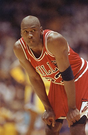 Chicago Bulls Michael Jordan takes a break during action against the Los Angeles Lakers in Game 3 of the NBA finals at the Forum in Inglewood, Calif., June 7, 1991. (AP Photo/Craig Fuji)