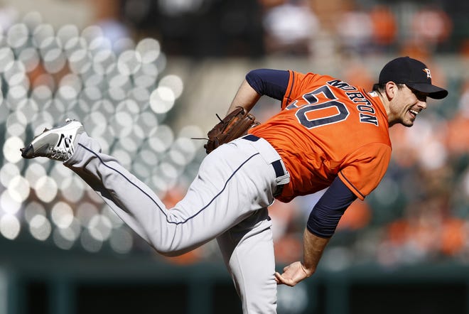 Houston Astros starting pitcher Charlie Morton follows through on a pitch to the Baltimore Orioles in the third inning of a baseball game, Sunday, Sept. 30, 2018, in Baltimore. (AP Photo/Patrick Semansky)