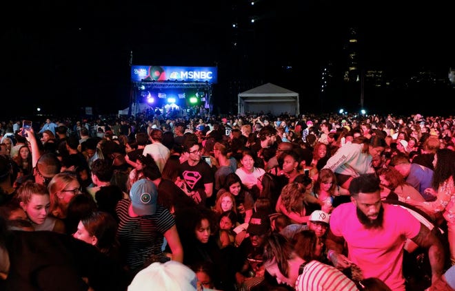 Concert goers surge forward after a barricade got knocked over at the 2018 Global Citizen Festival in Central Park on Saturday, in New York.