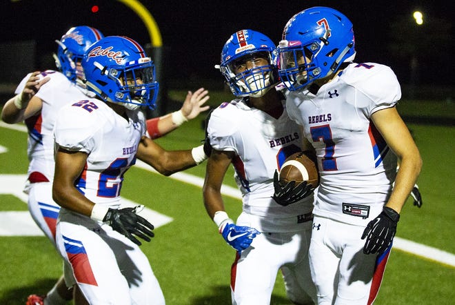 Hays running back Martin Shoemaker celebrates his touchdown run with teammates during a high school football game between Bowie and Hays at Burger Stadium on Friday. Hays is one of three undefeated Class 6A teams in the Austin area. [NICK WAGNER/AMERICAN-STATESMAN]