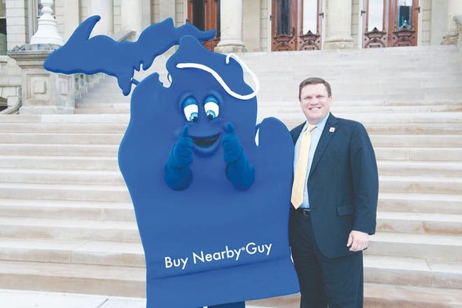 Michigan State Senator Wayne Schmidt of Traverse City, is joined by Buy Nearby Guy on the steps of the Michigan Capitol.
