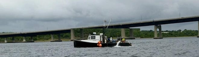 A shellfish relay dredge boat seen in Mount Hope Bay, south of the Braga Bridge. [Courtesy Fall River Harbormaster Bob Smith]