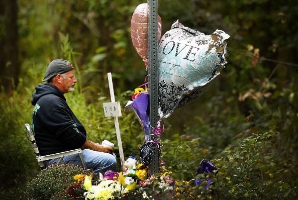 John Tallent sits in vigil where his fiancée Shana Warner was murdered last week. Greg Derr/The Patriot Ledger
