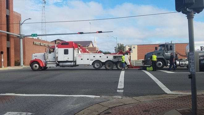 The intersection of 6th Street and Harrison Avenue was closed for several hours Monday morning for a tanker truck vs. scooter wreck. [KATIE LANDECK/THE NEWS HERALD]