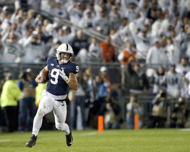 Penn State quarterback Trace McSorley rips off a big gain during Saturday night's loss to Ohio State. [CHRIS KNIGHT/THE ASSOCIATED PRESS]