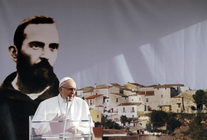 Pope Francis delivers a speech in March in Pietrelcina, Italy, the birthplace of St. Padre Pio. St. Pio, who is widely venerated in Italy and abroad is famous for bearing the stigmata, the wounds of crucified Jesus. A shawl — said to have been worn by Pio, will be on display Sunday at the annual Family Rosary Crusade at St. Joseph & St. Patrick Church at 702 Columbia St., Utica. [ASSOCIATED PRESS FILE PHOTO]