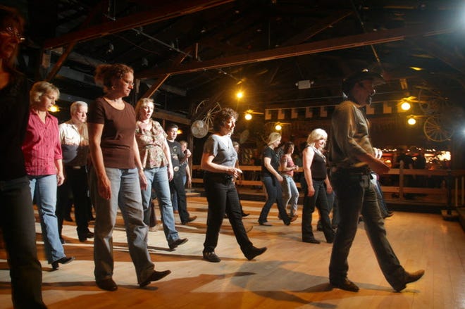 The Cowboy Rendezvous at the Stepping Stone Ranch in West Greenwich will include classes in line dancing on Friday at the Mishnock Barn. [The Providence Journal, file / Kris Craig]
