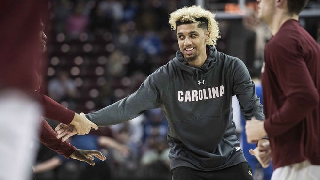 College basketball recruit Brian Bowen is photographed before an NCAA college basketball game in Columbia, S.C., on Jan. 16. A recruiter, a coach and a former Adidas executive are scheduled to go on trial in New York in a criminal case that exposed corruption in several top U.S. college basketball programs. [AP Photo/Sean Rayford]