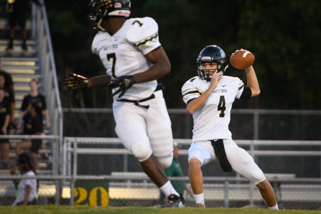 Gray's Creek quarterback Ben Lovette (4) looks for a receiver as Andre Allen (7) looks for the ball. Gray's Creek beat E.E. Smith and Cape Fear in its two games following Hurricane Florence. [Andrew Craft/The Fayetteville Observer]
