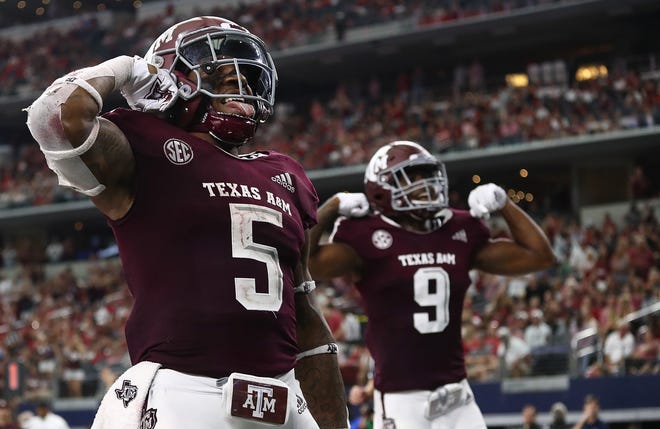 Texas A&M's Trayveon Williams celebrates a touchdown against Arkansas. He's No. 2 in the SEC in rushing. [Ronald Martinez/Getty Images]