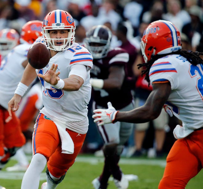 Florida quarterback Feleipe Franks (13) pitches out to running back Jordan Scarlett (25) during the first half of a game against Mississippi State last Saturday. [AP Photo/Rogelio V. Solis]