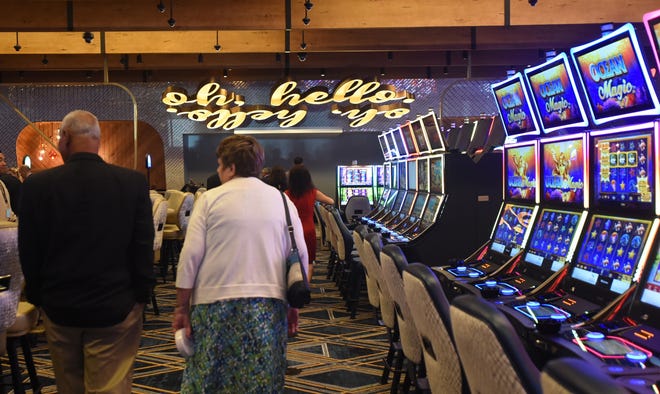 After the ribbon-cutting ceremonies, visitors get their first look at the Tiverton Casino Hotel, where a greeting of "Oh, Hello" and a mirror image of it are seen in lights on the ceiling. [Herald News File Photo | Jack Foley]