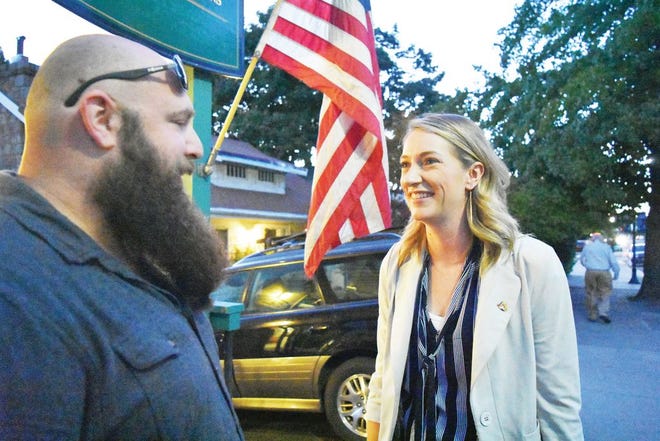 Congressional candidate Audrey Denney speaks with a concerned citizen during a campaign stop in Mount Shasta on Sept. 25.