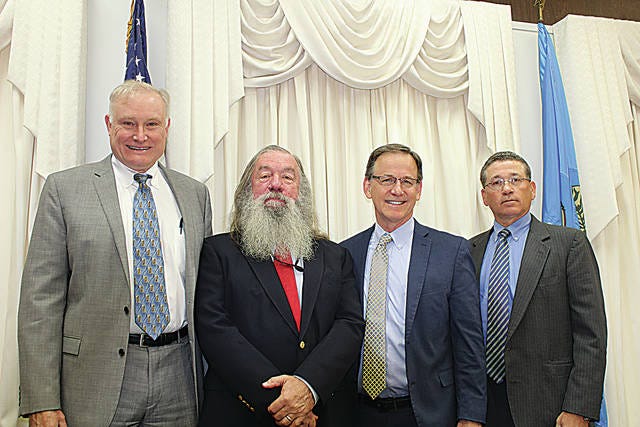 From left are John Thomas Briggs, B. David Gambill, John Kane and Stuart Tate. Briggs will soon become Special Judge. Gambill is retiring from the bench. Kane will soon begin a new term as District Judge; and Tate will succeed Gambill as Associate District Judge.