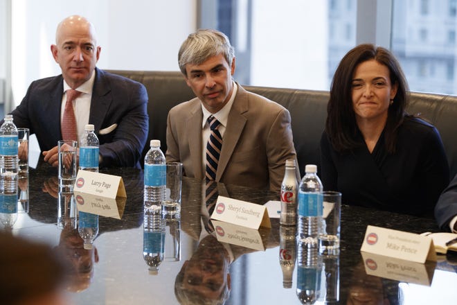FILE- In this Dec. 14, 2016, file photo from left, Amazon founder Jeff Bezos, Alphabet CEO Larry Page and Facebook COO Sheryl Sandberg listen as President-elect Donald Trump speaks during a meeting with technology industry leaders at Trump Tower in New York. California has become the first state to require publicly traded companies to include women on their boards of directors. The measure requires at least one female director on the board of each California-based public corporation by the end of next year. (AP Photo/Evan Vucci, File)