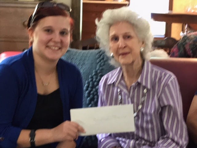 Brianna Boahn, left, a horticulture student at Fayetteville Technical Community College, is recipient of the $500 Hattie Rankin Scholarship from the Cross Creek-Briarwood Garden Club. The scholarship was presented by Billie Widman, a member of the club scholarship committee. [Contributed photo]