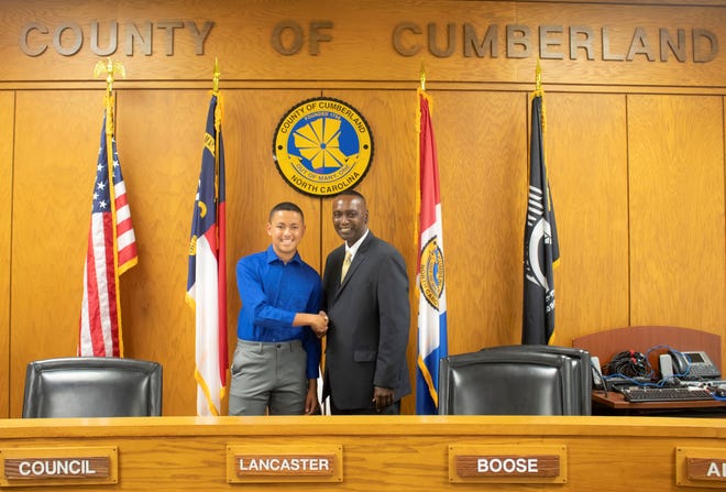 Alizdair Sebastien Ray stands with Cumberland County Commissioner Charles Evans. Ray recently attended the N.C. Association of County Commissioners' YouthVoice Conference in Hickory. [Contributed photo]