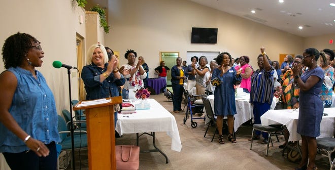 Cheryl Dennison, left, acted as the presider at the inaugural women's conference hosted by the Mount Moriah Baptist Church Women's Ministry Saturday. Women from churches throughout the area gathered to chat about life and women's empowerment. [PHOTOS BY CAT GLORIA/SPECIAL TO THE GUARDIAN]