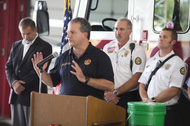 Florida Chief Financial Officer Jimmy Patronis gives buckets of fire decontamination gear to the Panama City Fire Department on Tuesday. Firefighters encounter a great deal of carcinogens, and the donated gear will help lower firefighters’ interaction with possibly cancer causing carcinogens. [JOSHUA BOUCHER/THE NEWS HERALD]