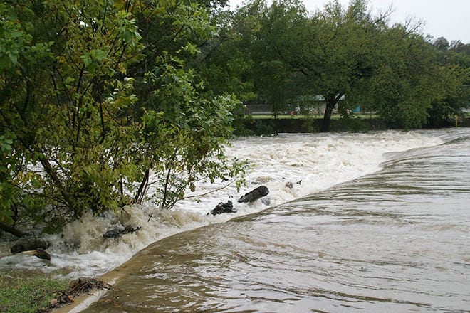 The city is offering a FloodWarn class from 6-8 p.m. Oct. 17 at the new public safety training center. Pictured: Brushy Creek swells after heavy rains in October 2015. [File photo, Mike Parker]