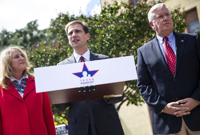 Attorney General candidate Justin Nelson, center, and Democratic candidate for lieutenant governor, Mike Collier, right, accept the endorsement Thursday of the Texas Parent PAC in Austin. PAC official Dinah Miller is left. [NICK WAGNER/AMERICAN-STATESMAN]