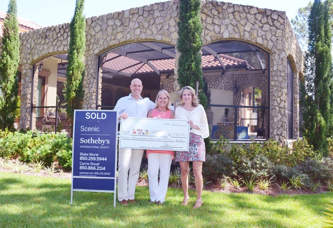 Scenic Sotheby’s International Realty generously donated more than $13,000 of their commission to the Pierce Family Children’s Advocacy Center. Blake Morar (from left) and Carrie Shoaf with Scenic Sotheby’s are shown with Julie Hurst-Porterfield, CEO of ECCAC. [CONTRIBUTED PHOTO]