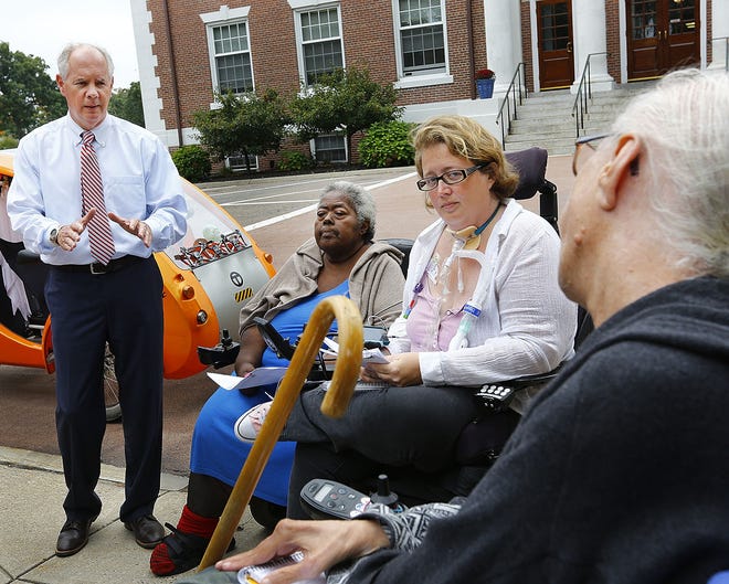 Mayor Joe Sullivan listens to complaints from handicapped access advocates Joanne Daniels-Finegold, Crystal Evens and Penny Shaw at town hall on Thursday Oct. 4, 2018 Greg Derr/The Patriot Ledger