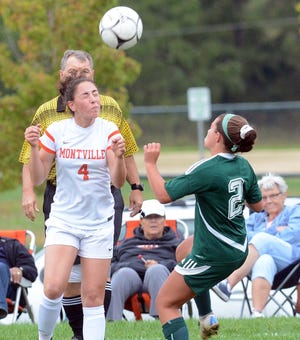 Montville’s Alexis DeLucia heads the ball away from Griswold’s Bella Rubino Thursday during the Indians’ 5-1 win in Griswold. [John Shishmanian/ NorwichBulletin.com]