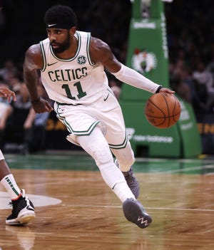 Boston's Kyrie Irving told a group of Celtics season ticket holders that he wanted to re-sign with the team after the season. [The Associated Press]